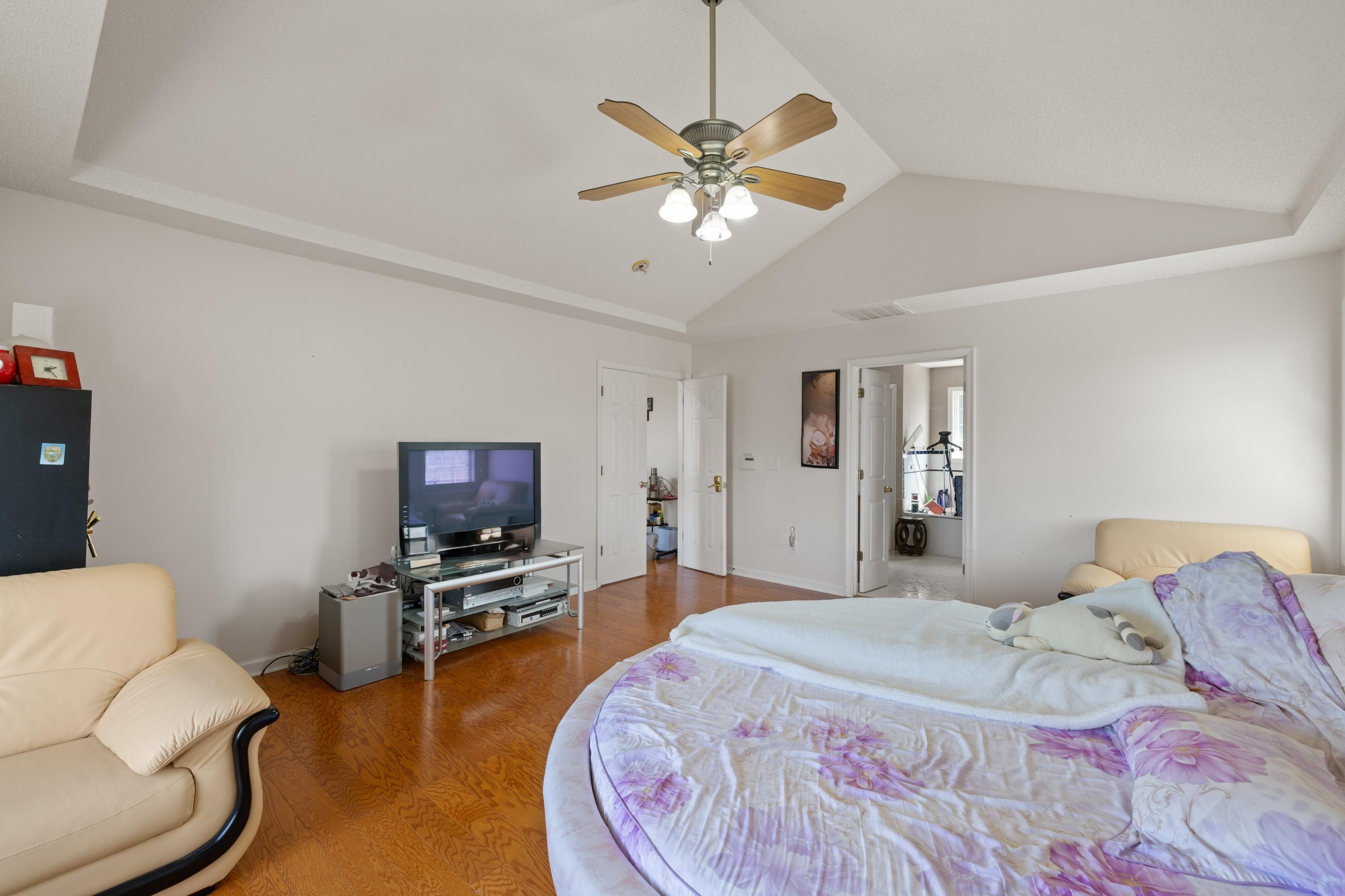 635 Long Meadow Road Fishersville, VA 22939 - Photo 26 of 63 a bedroom with a bed furniture and a flat screen tv