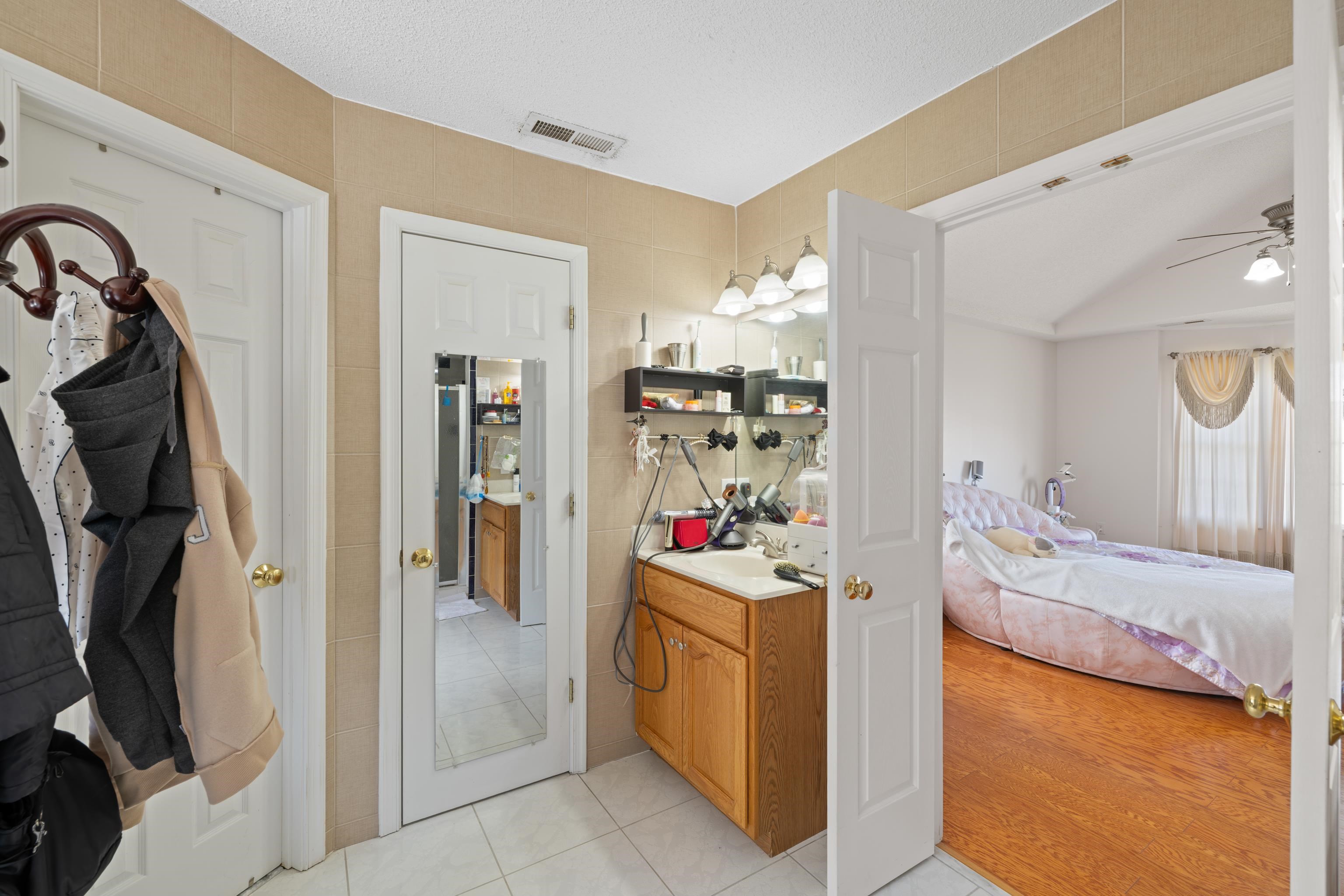 635 Long Meadow Road Fishersville, VA 22939 - Photo 27 of 63 a bedroom with a bed and a view of bathroom