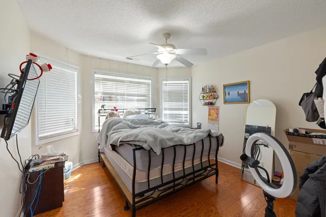 a bedroom with bed and a window