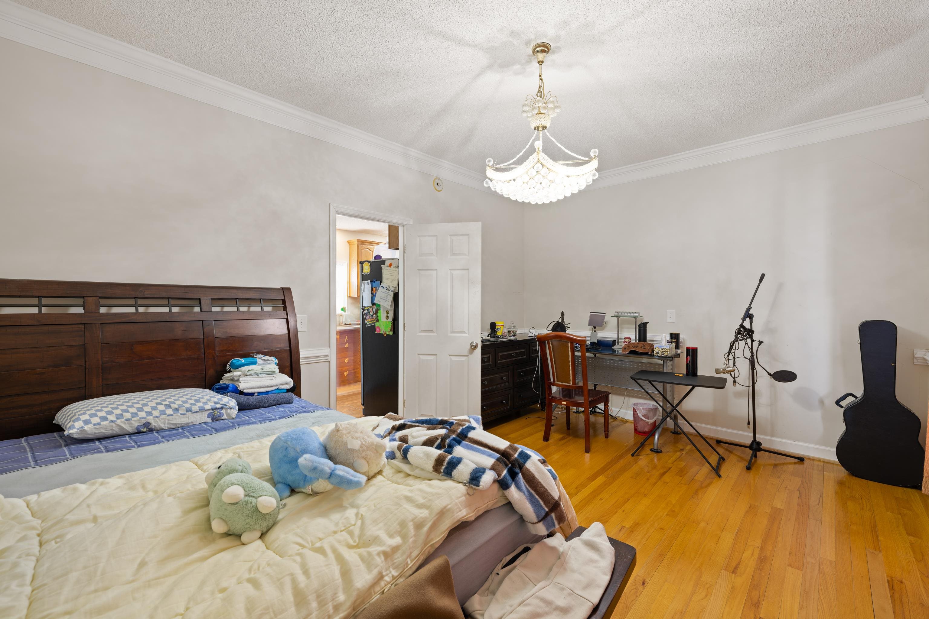 635 Long Meadow Road Fishersville, VA 22939 - Photo 39 of 63 a bedroom with a bed and wooden floor