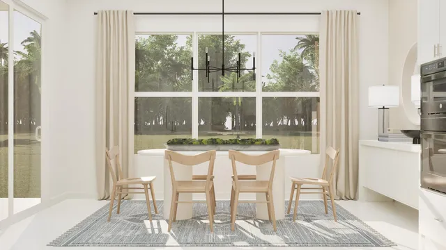 a dining room with furniture and large windows