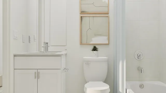 a bathroom with a toilet sink and shower