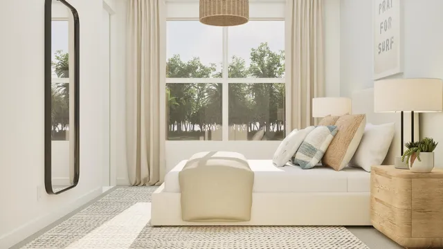 a bed sitting in a bedroom next to a window