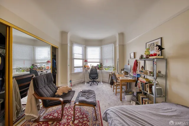 a kitchen with granite countertop a refrigerator stove and cabinets