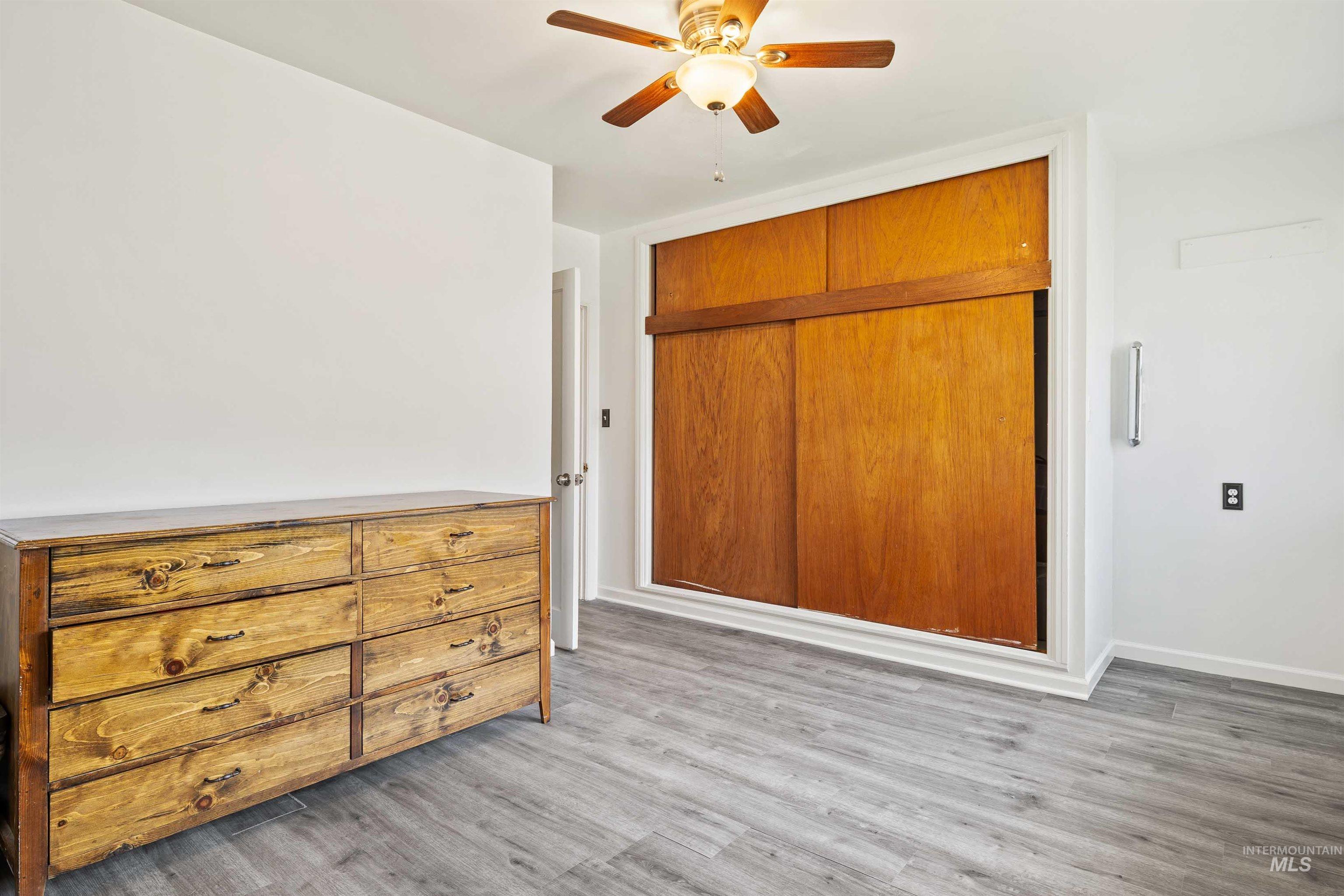 817 Union Avenue Filer, ID 83328 - Photo 17 of 37 Unfurnished bedroom with light wood finished floors, ceiling fan, and a closet