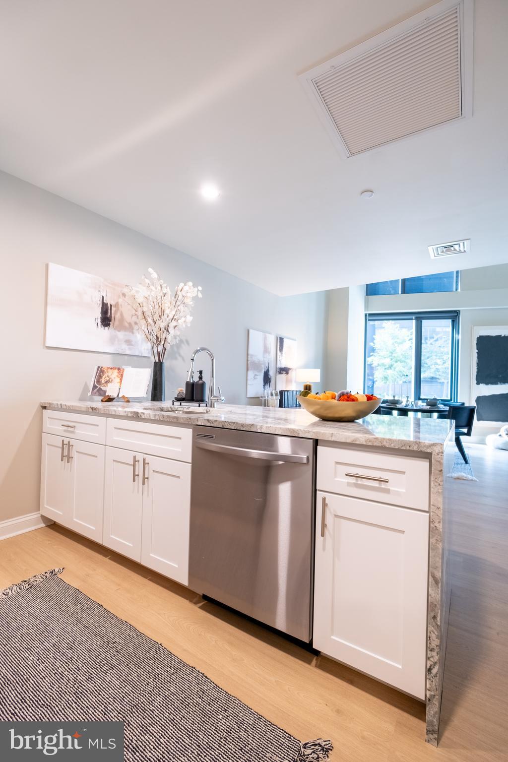 2301-61 John F Kennedy Boulevard, Unit 103 Philadelphia, PA 19103 - Photo 7 of 41 a kitchen with white cabinets and white appliances