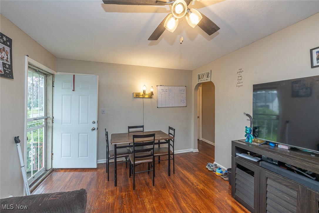 21202 Franklin Road Maple Heights, OH 44137 - Photo 5 of 28 Dining area featuring arched walkways, wood finished floors, a ceiling fan, and baseboards