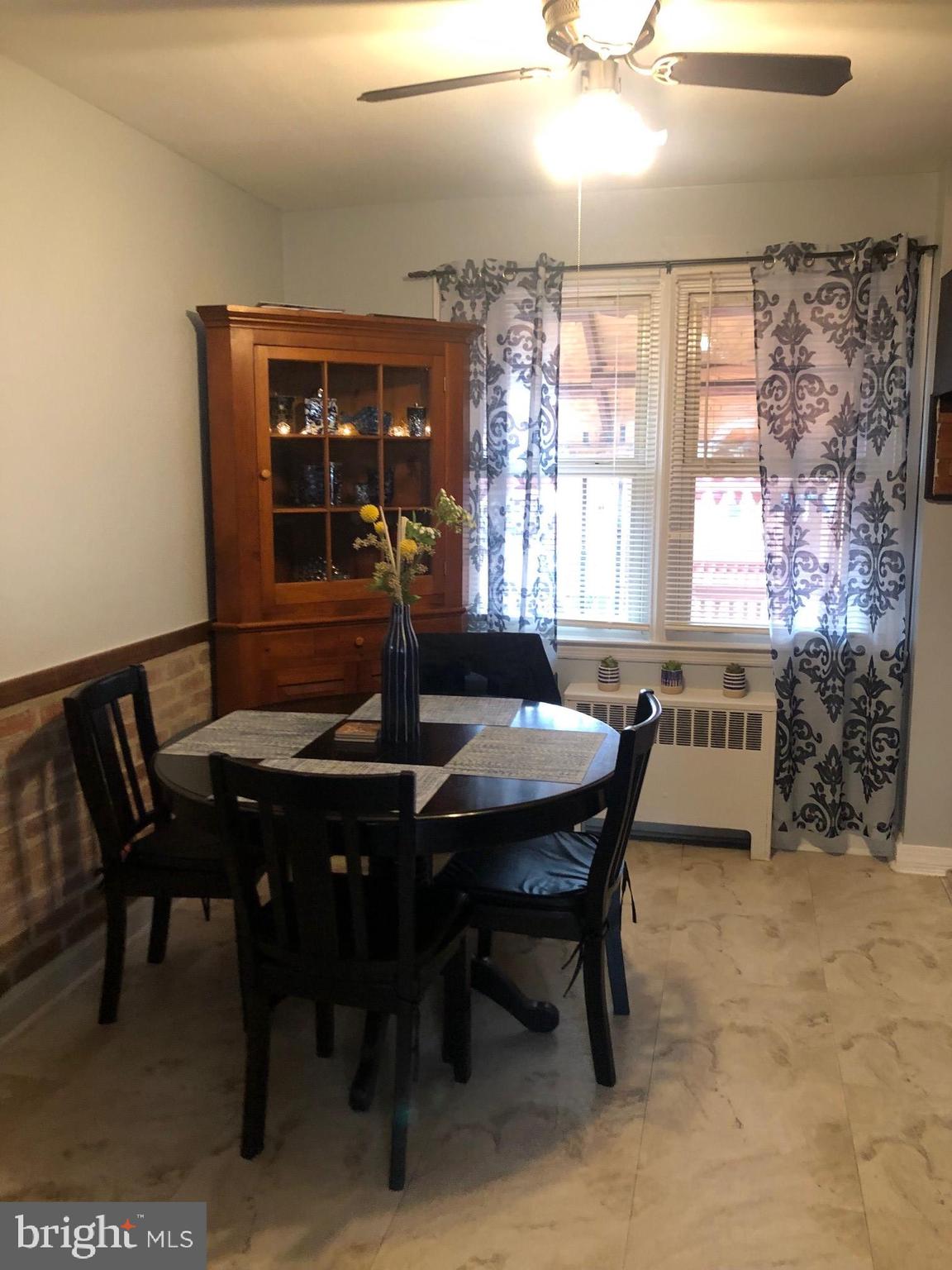 3924 Colchester Road Baltimore, MD 21229 - Photo 3 of 15 a view of a dining room with furniture and window