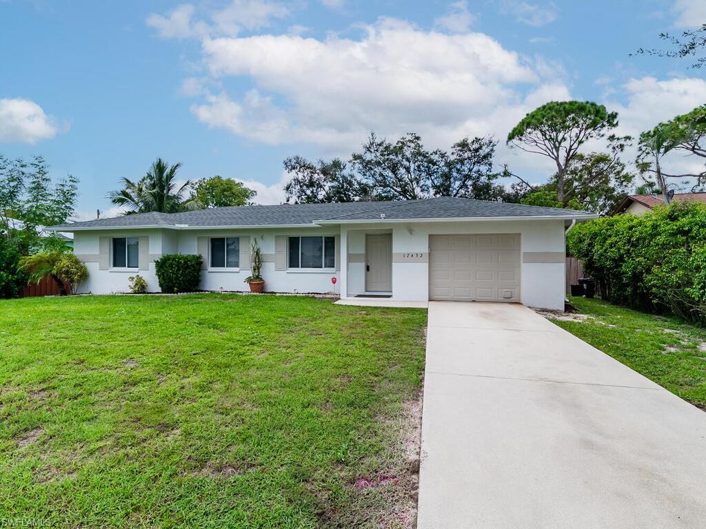 front view of a house with a yard