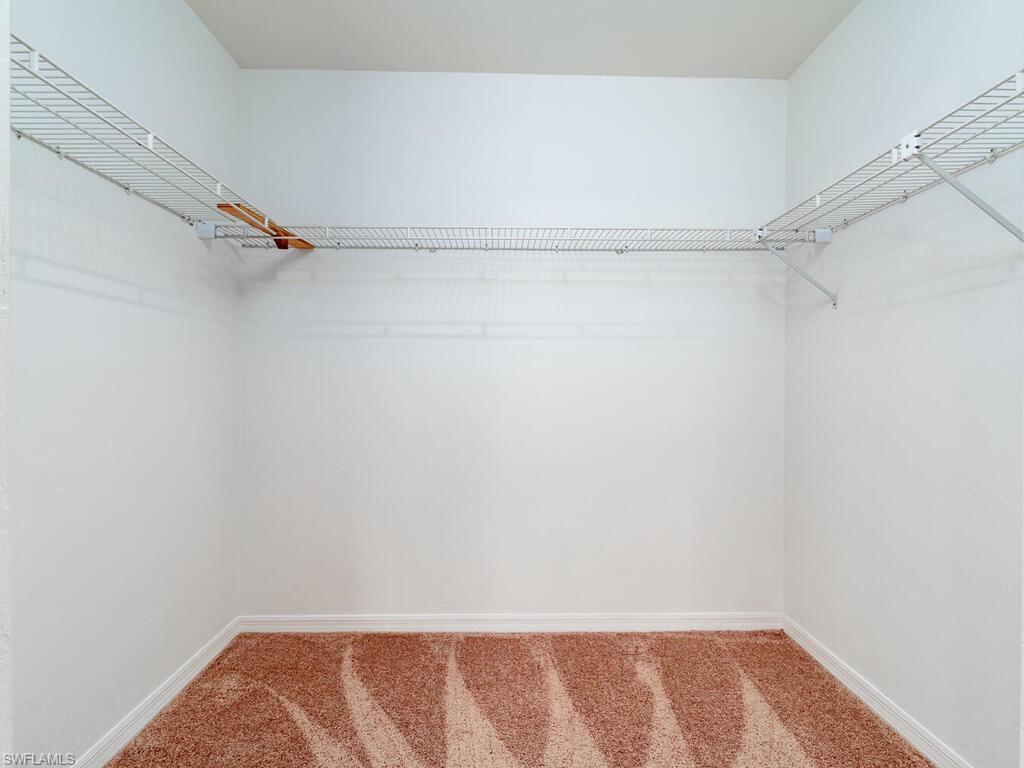 17432 Lee Road Fort Myers, FL 33967 - Photo 14 of 24 a view of small space with racks on the wall