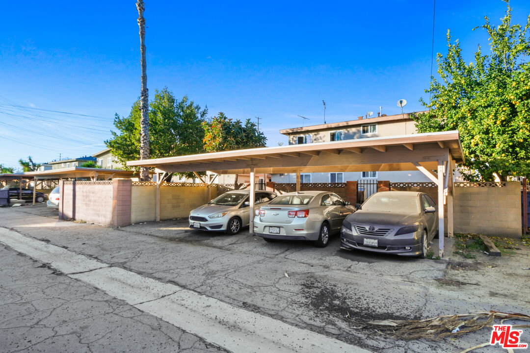 10018 Foster Road Bellflower, CA 90706 - Photo 10 of 10 a view of parking with cars parked