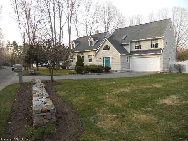 Exterior Front. Stone walls and asphalt driveway