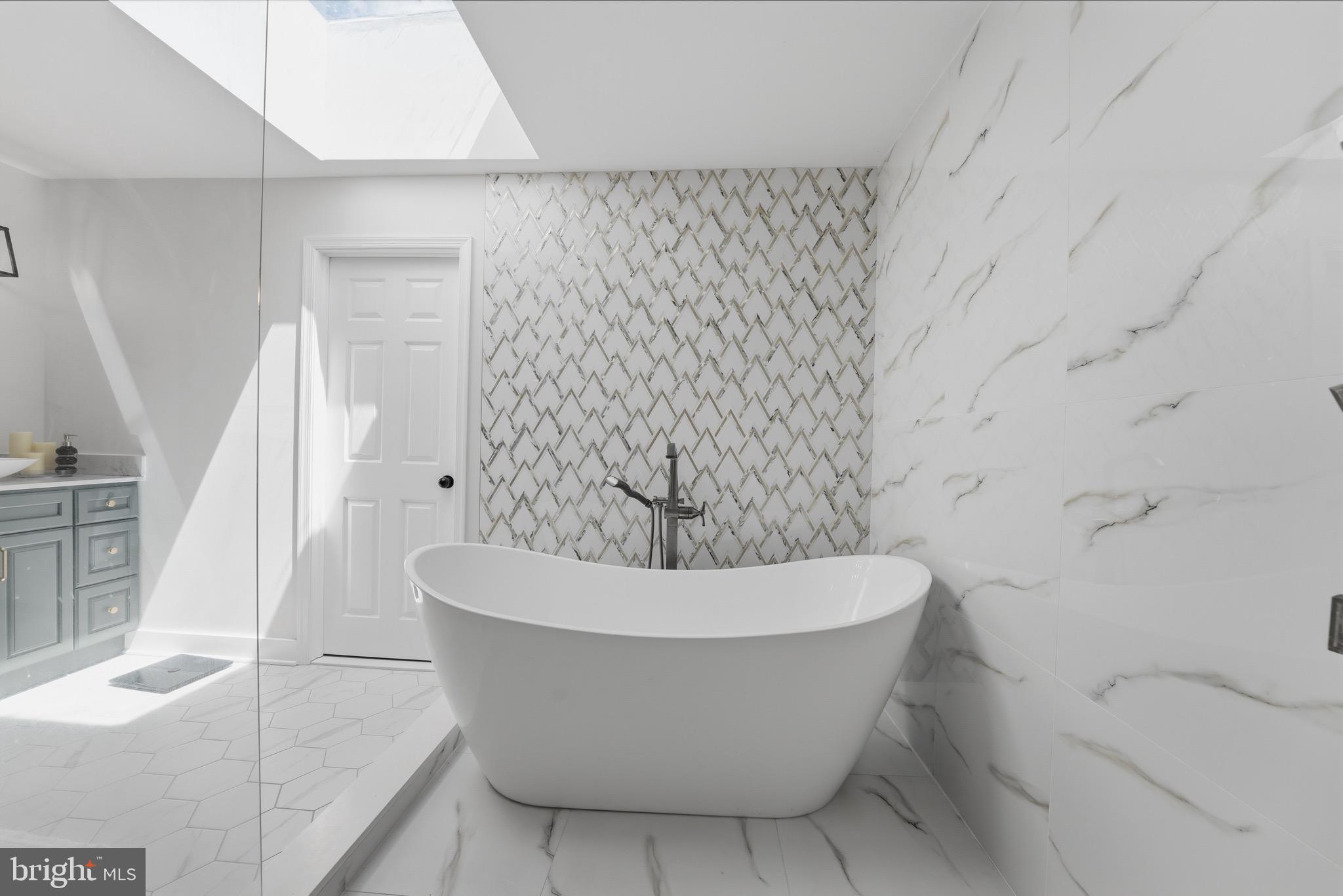 2919 Davidsonville Road Davidsonville, MD 21035 - Photo 17 of 61 a white bath tub sitting in a bathroom
