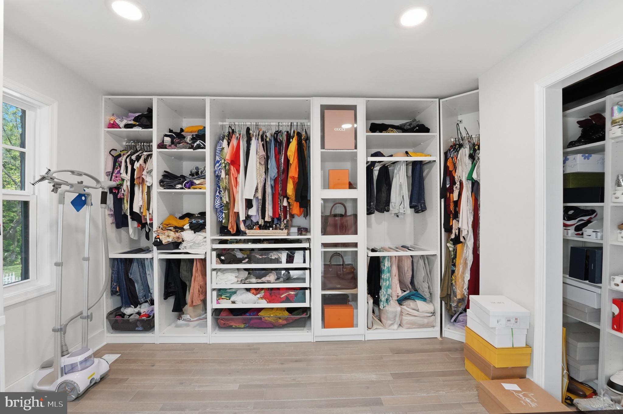 2919 Davidsonville Road Davidsonville, MD 21035 - Photo 22 of 61 a view of walk in closet with clothes and shoes