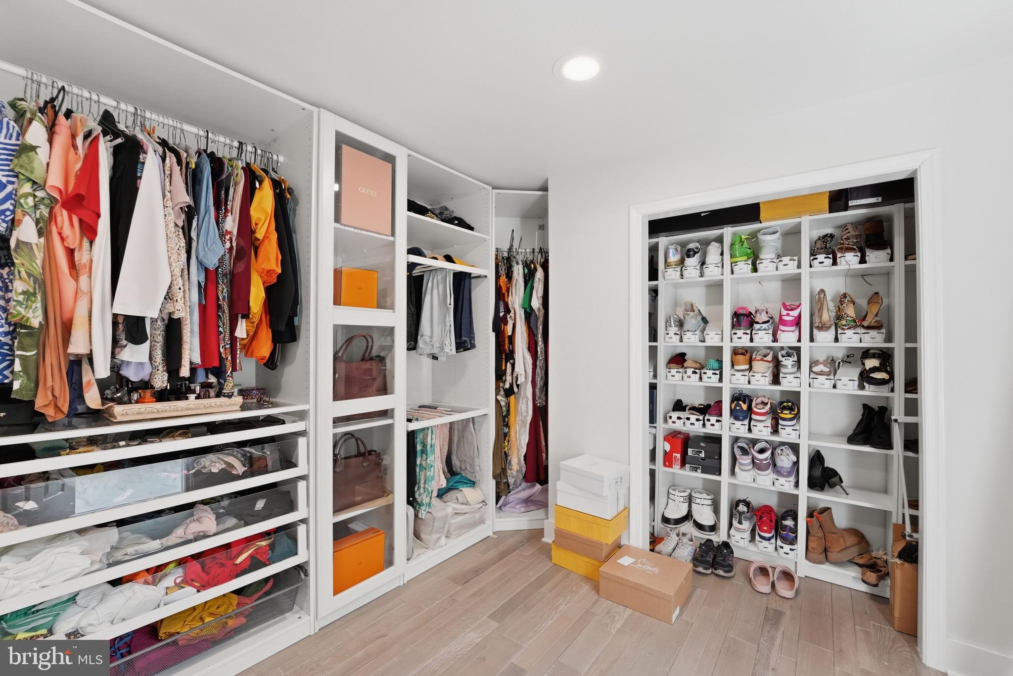 2919 Davidsonville Road Davidsonville, MD 21035 - Photo 23 of 61 a view of walk in closet with clothes and shoes