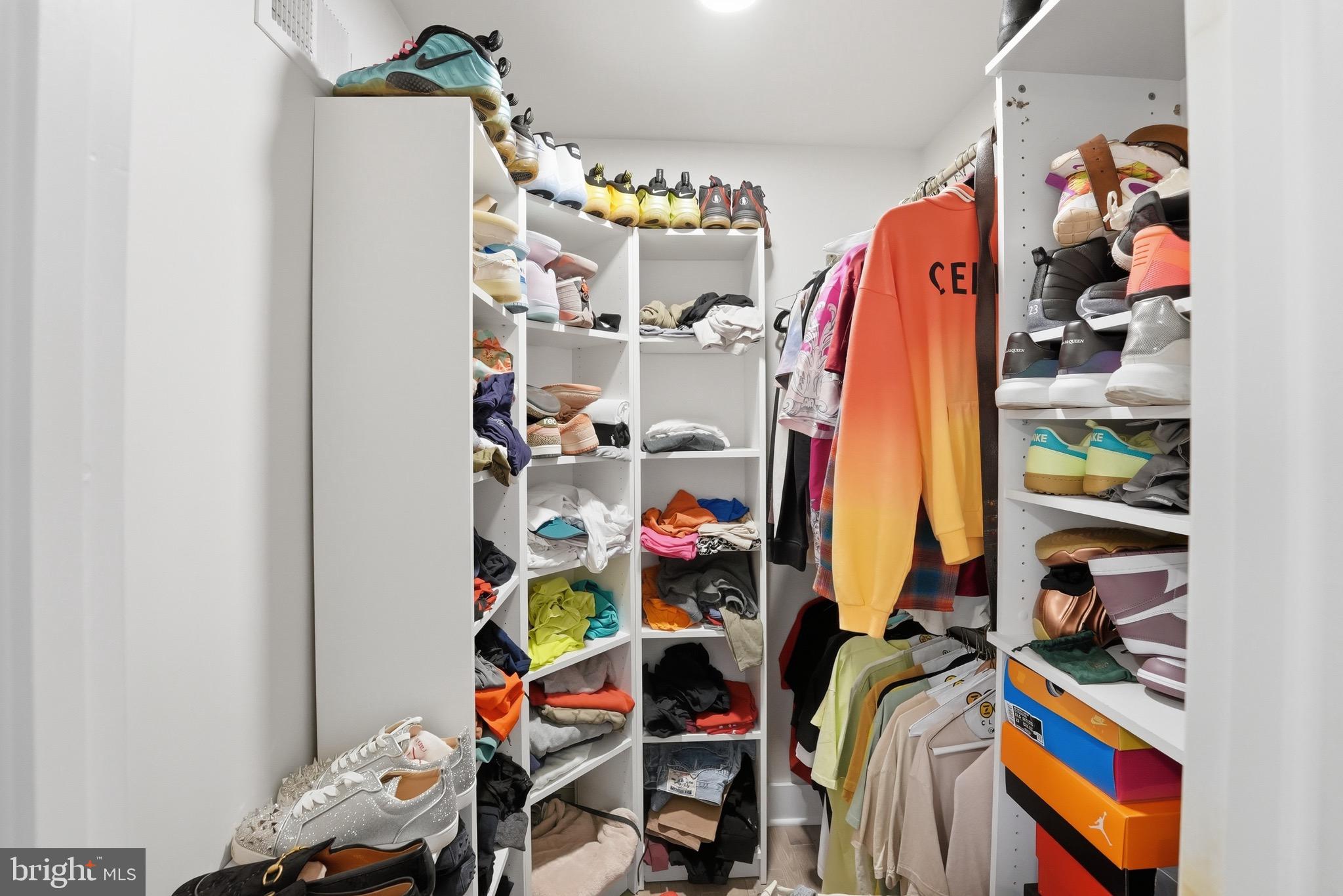 2919 Davidsonville Road Davidsonville, MD 21035 - Photo 25 of 61 a view of walk in closet with clothes and shoes