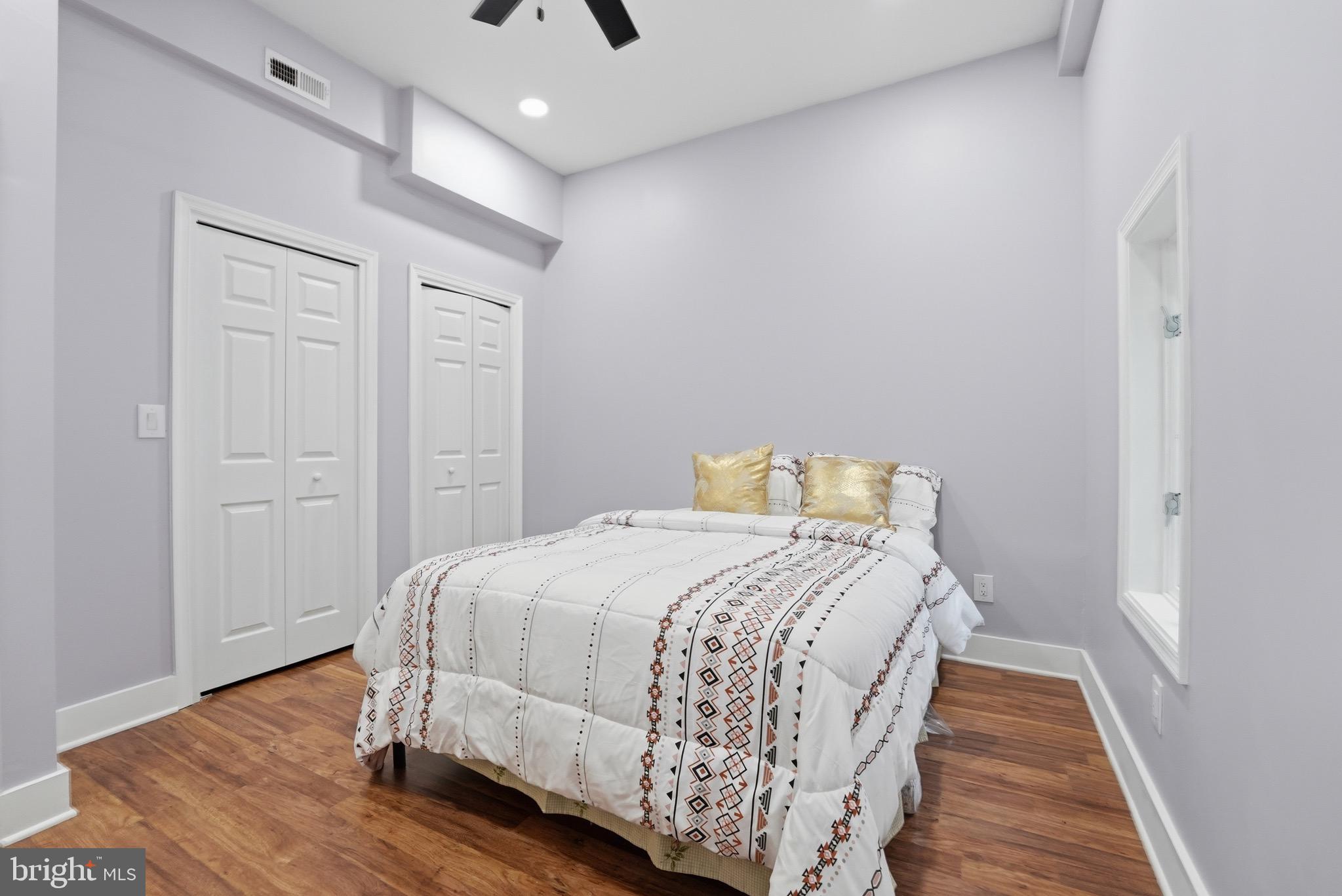 2919 Davidsonville Road Davidsonville, MD 21035 - Photo 46 of 61 a bedroom with a bed and wooden floor