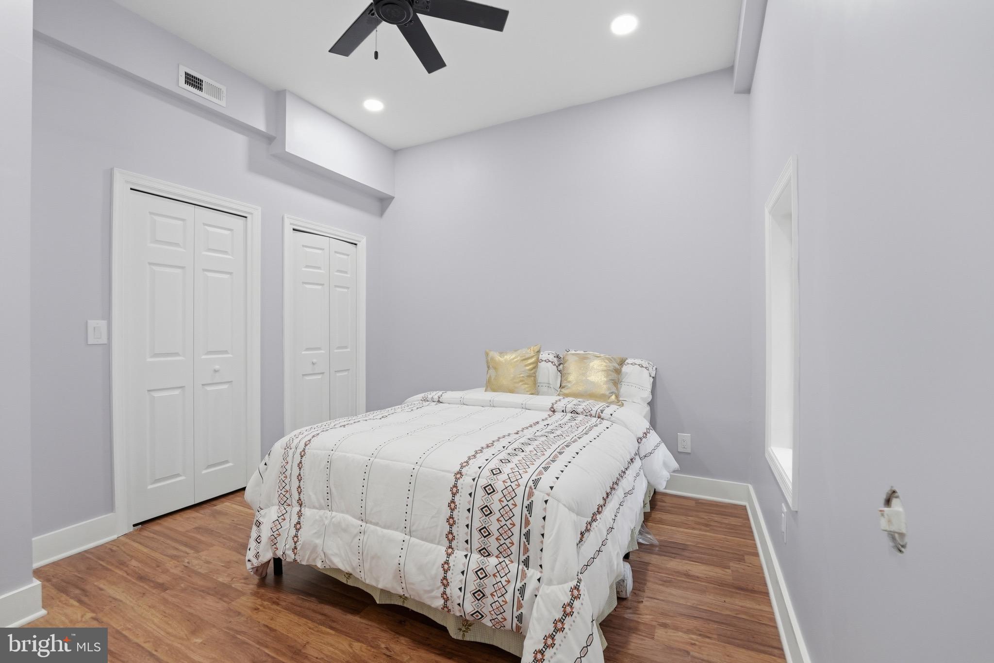 2919 Davidsonville Road Davidsonville, MD 21035 - Photo 47 of 61 a bedroom with a bed and wooden floor