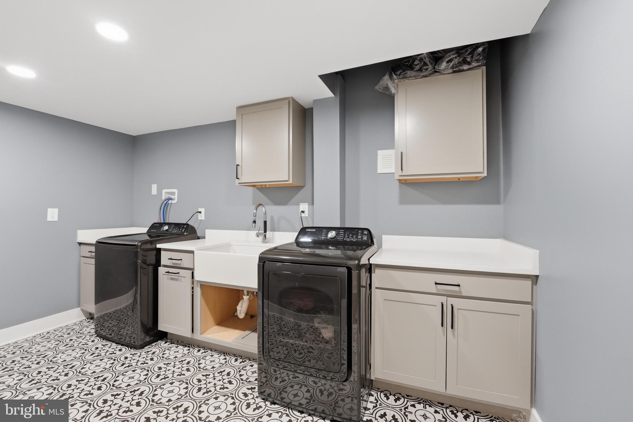 2919 Davidsonville Road Davidsonville, MD 21035 - Photo 50 of 61 a kitchen with a stove a sink and a microwave