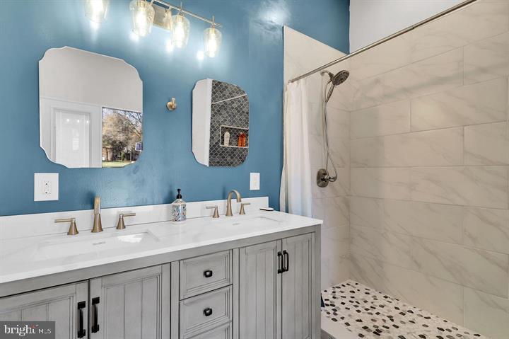 2919 Davidsonville Road Davidsonville, MD 21035 - Photo 54 of 61 a bathroom with a sink a vanity and a mirror