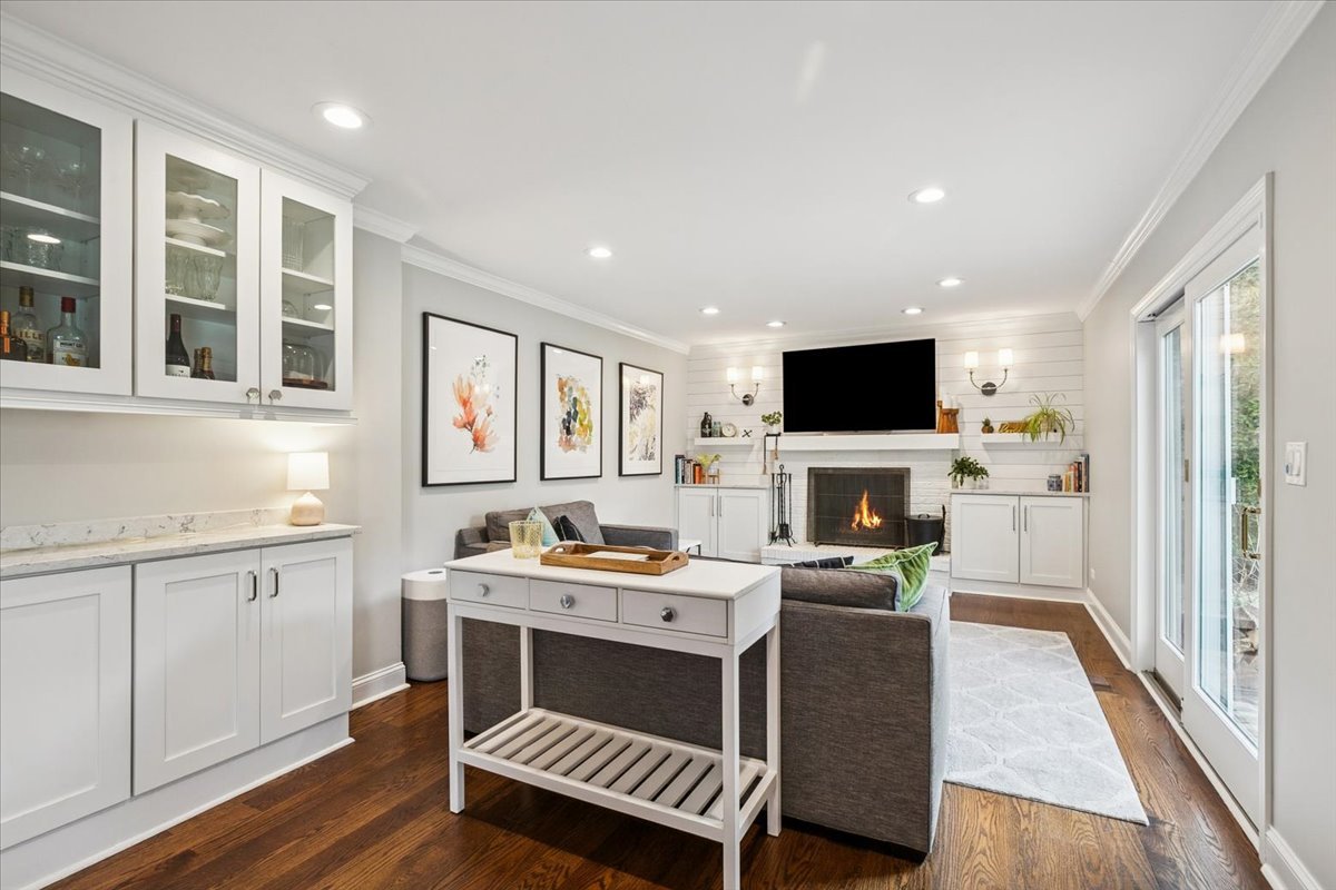 216 East Scranton Avenue Lake Bluff, IL 60044 - Photo 11 of 32 a room with furniture a flat screen tv and a fireplace