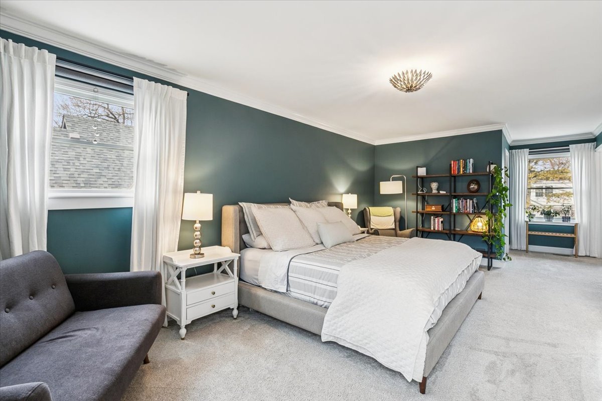 216 East Scranton Avenue Lake Bluff, IL 60044 - Photo 16 of 32 a bed room with a bed window and a couch