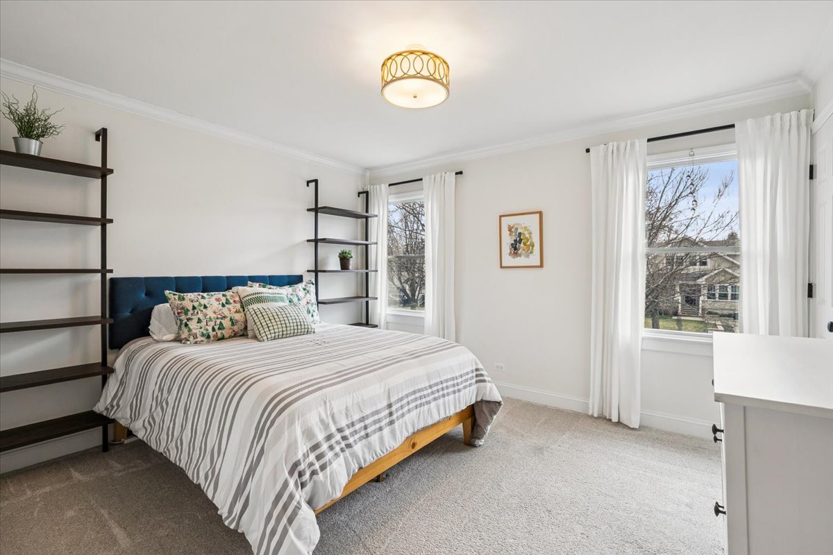 216 East Scranton Avenue Lake Bluff, IL 60044 - Photo 18 of 32 a bedroom with a bed and a window