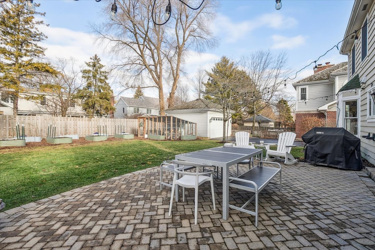 216 East Scranton Avenue Lake Bluff, IL 60044 - Photo 25 of 32 a table and chairs sitting in backyard of a house
