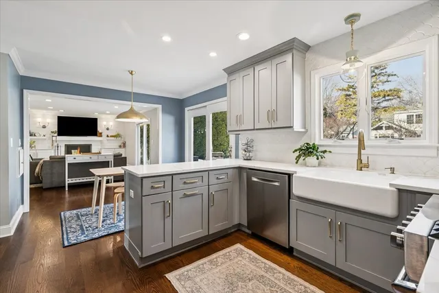 a kitchen with a sink cabinets and window