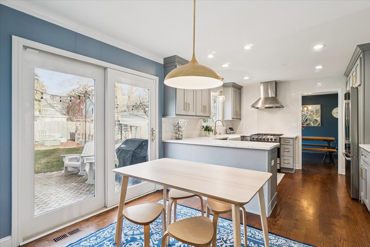 216 East Scranton Avenue Lake Bluff, IL 60044 - Photo 8 of 32 a large kitchen with a table and chairs in it