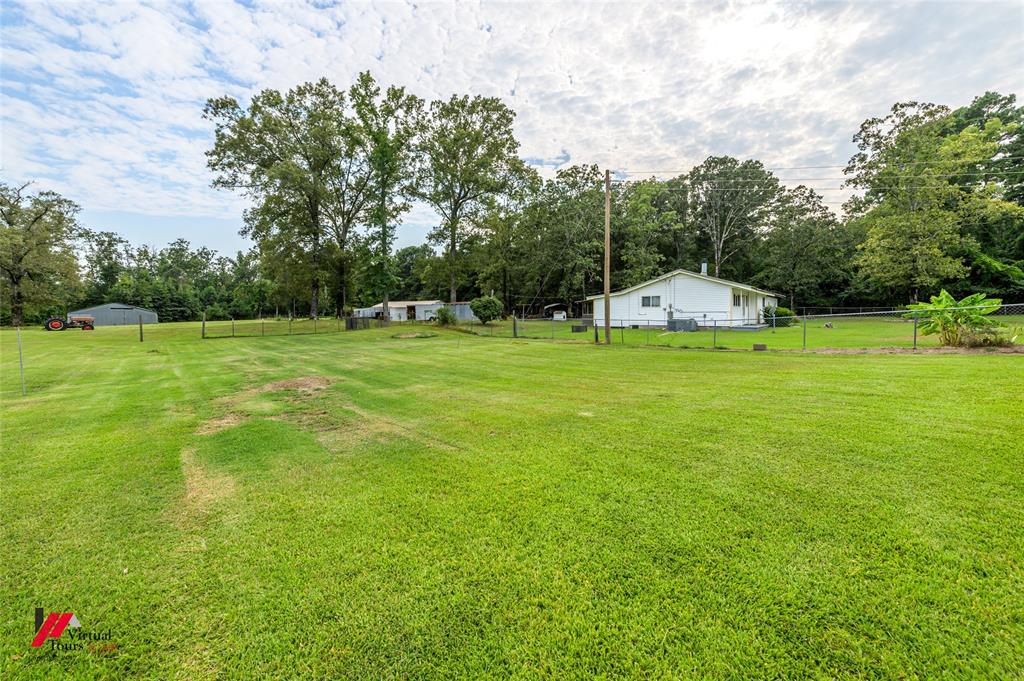 469 Foreman Road Doyline, LA 71023 - Photo 15 of 32 a view of a big yard with swimming pool