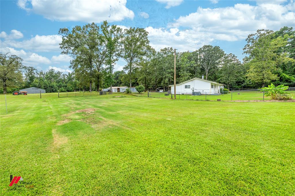 469 Foreman Road Doyline, LA 71023 - Photo 16 of 32 a view of a big yard with a house