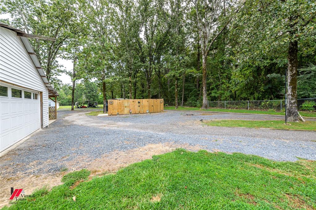 469 Foreman Road Doyline, LA 71023 - Photo 19 of 32 a view of a backyard with a garden and entertaining space