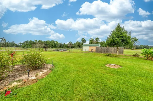 a view of a lake with a big yard