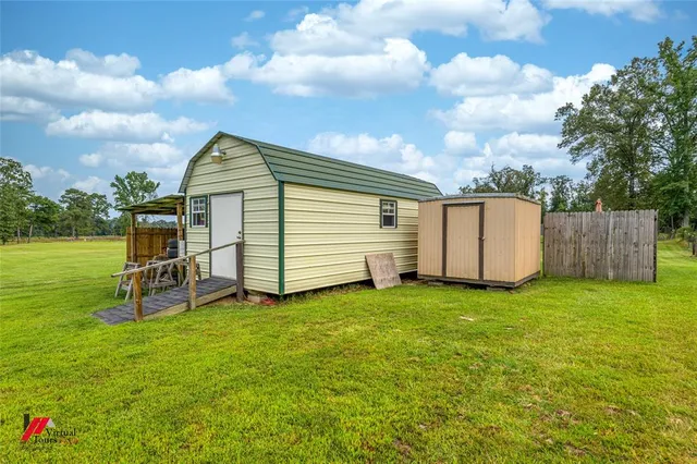 a view of a backyard with garden