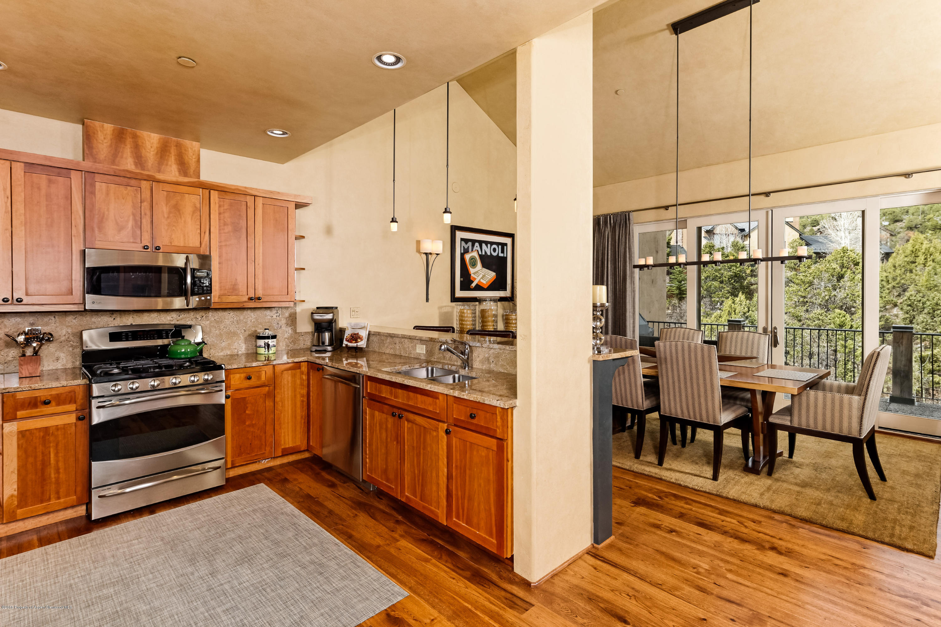206 Wild Spring Lane Basalt, CO 81621 - Photo 7 of 18 a kitchen with stainless steel appliances granite countertop a stove top oven a sink and cabinets