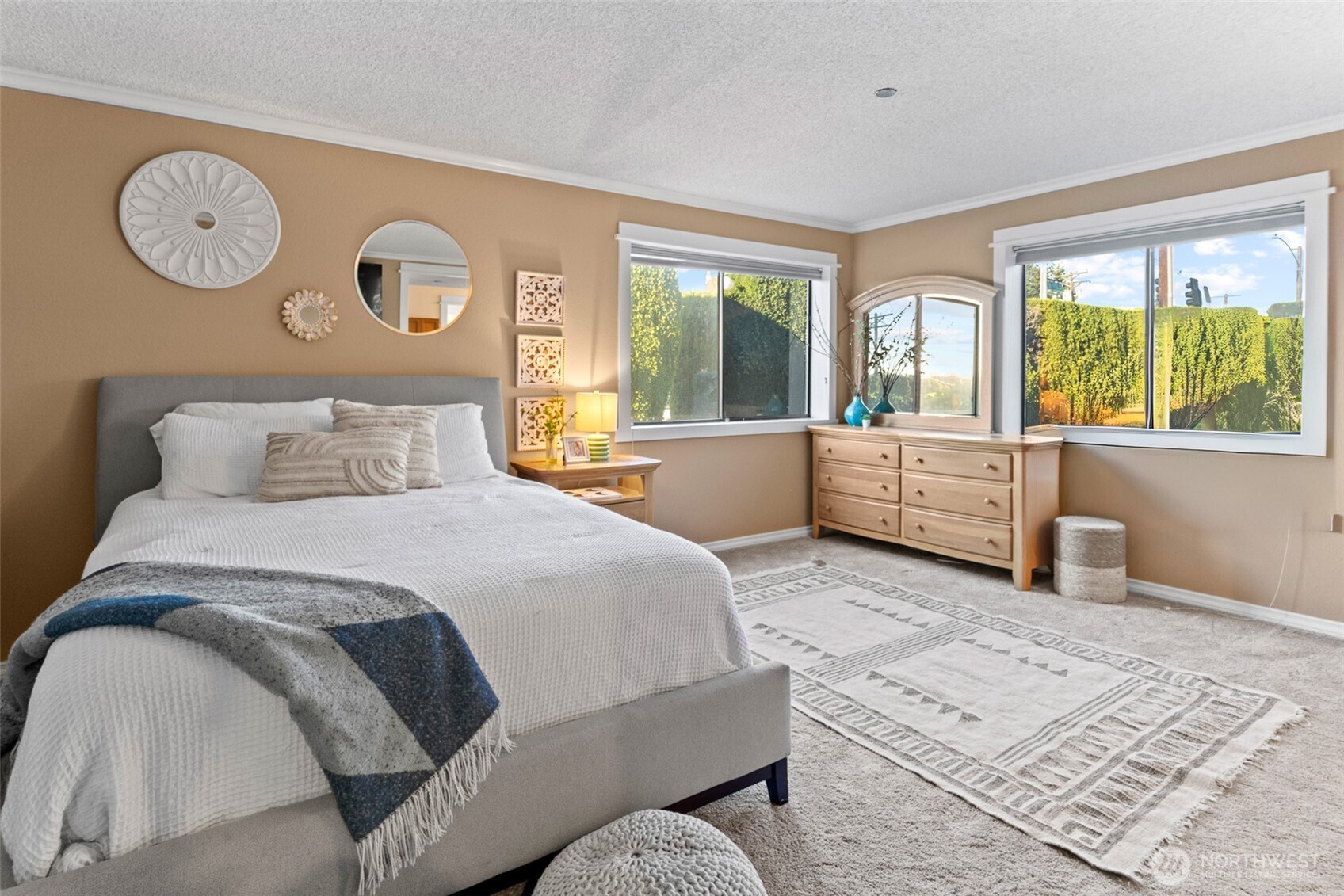 1902 Bridgeport Way West, Unit 106 University Place, WA 98466 - Photo 16 of 25 a bedroom with a large bed and a large window