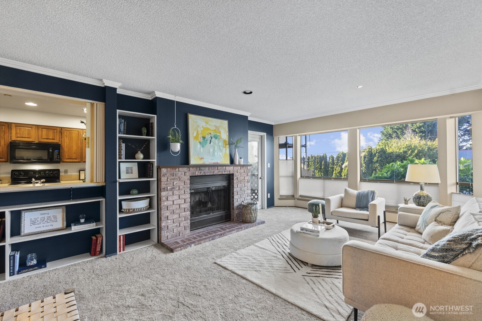1902 Bridgeport Way West, Unit 106 University Place, WA 98466 - Photo 3 of 25 a living room with furniture and a flat screen tv