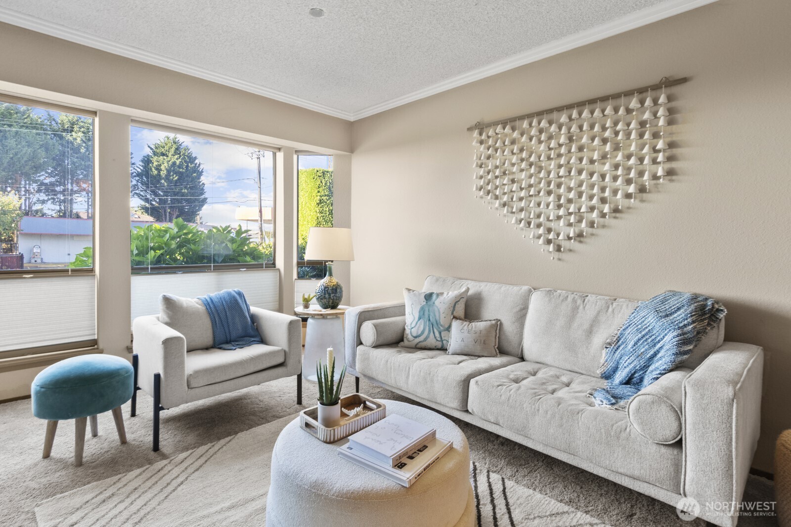 1902 Bridgeport Way West, Unit 106 University Place, WA 98466 - Photo 4 of 25 a living room with furniture and a large window with garden view