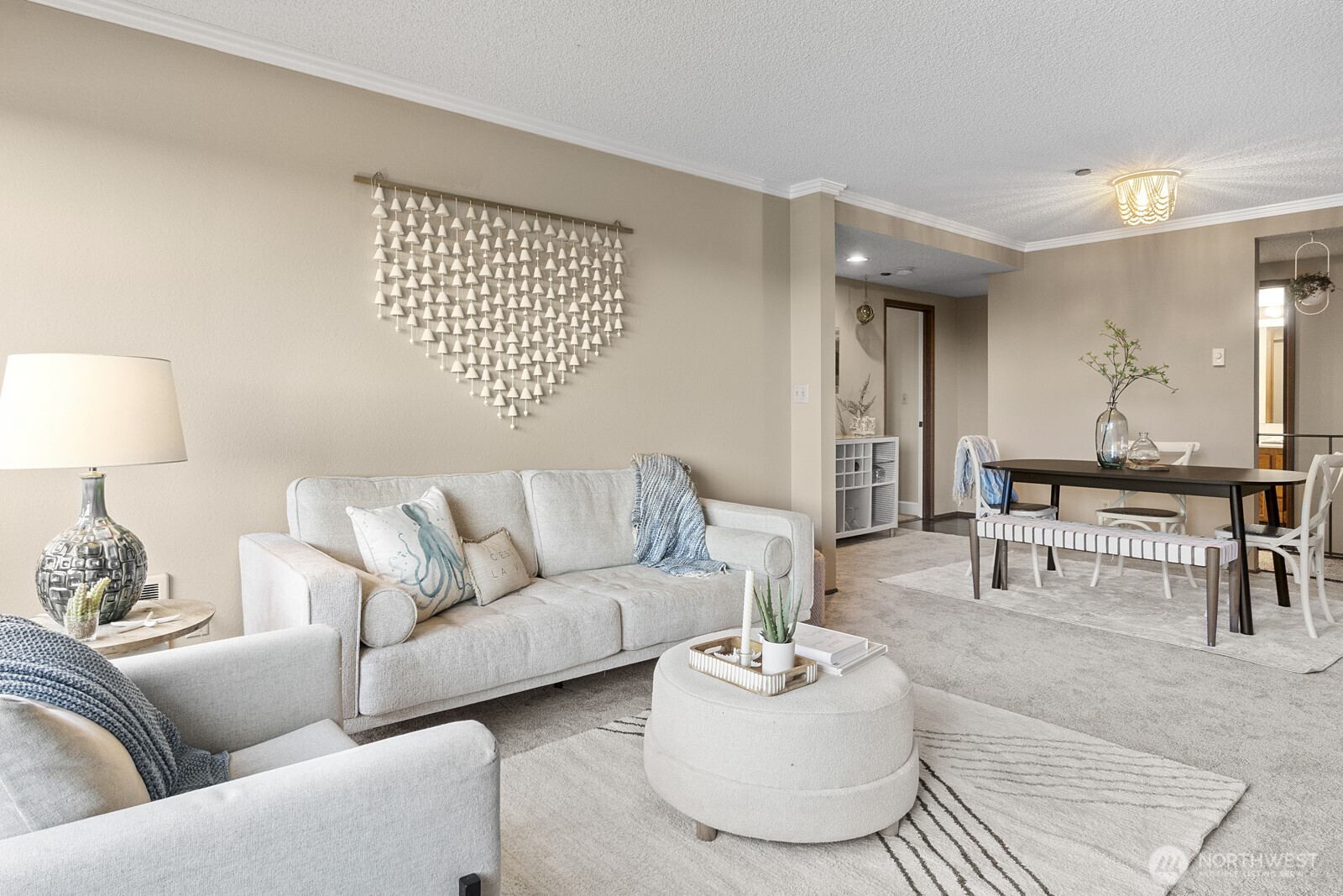 1902 Bridgeport Way West, Unit 106 University Place, WA 98466 - Photo 5 of 25 a living room with furniture and a table