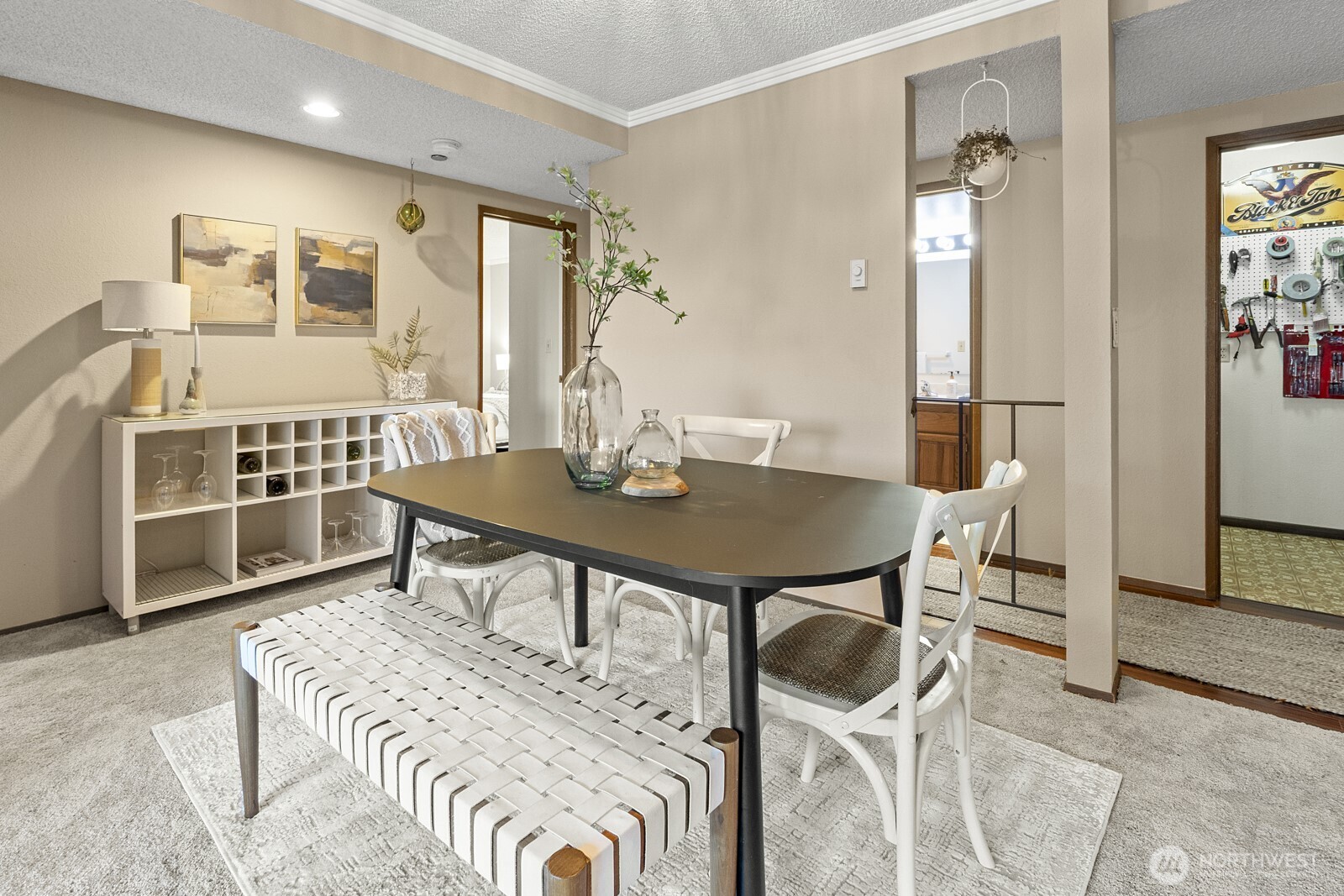 1902 Bridgeport Way West, Unit 106 University Place, WA 98466 - Photo 6 of 25 a view of a dining room with furniture and a chandelier