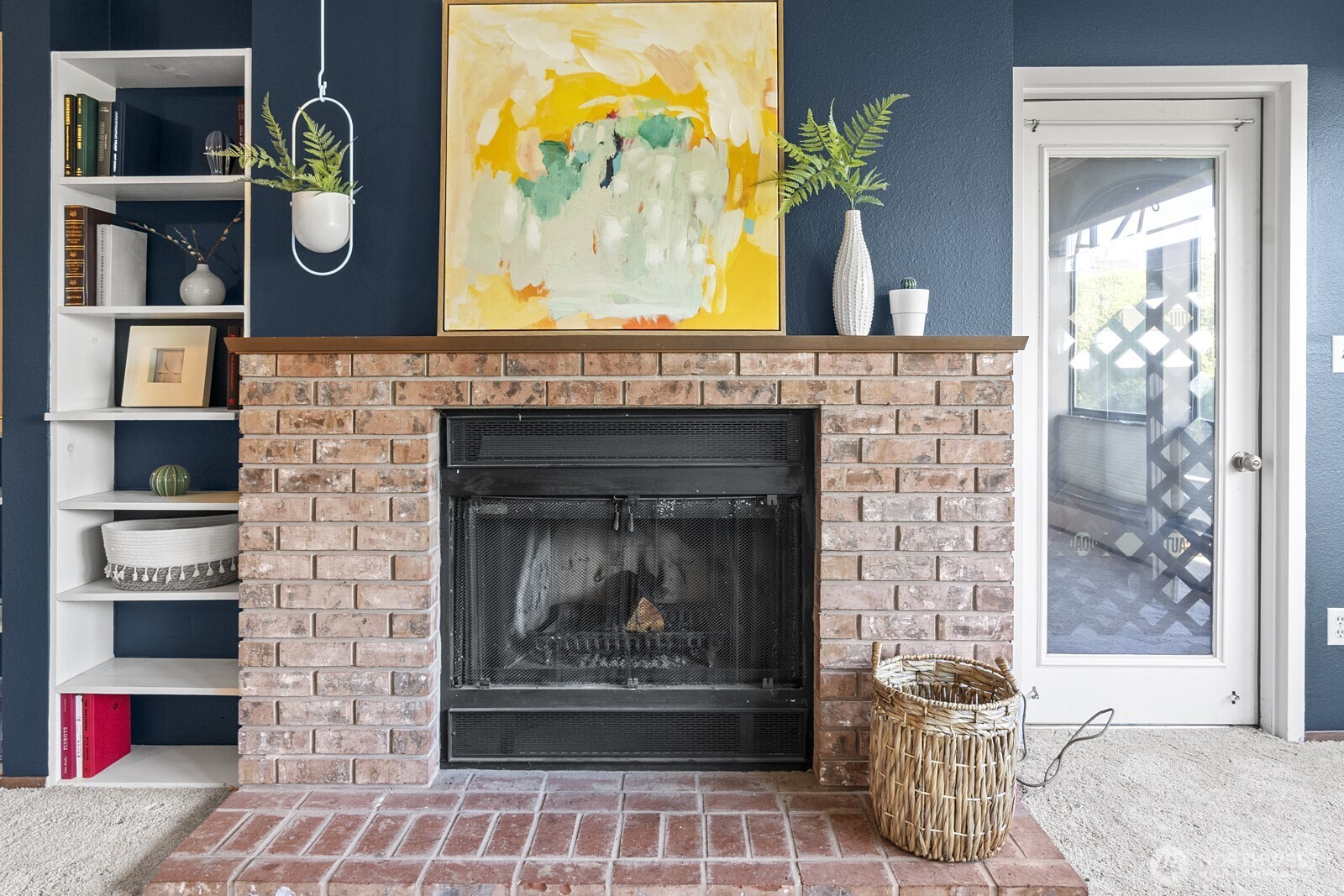1902 Bridgeport Way West, Unit 106 University Place, WA 98466 - Photo 9 of 25 a front view of a fireplace with wooden floor and flat screen tv