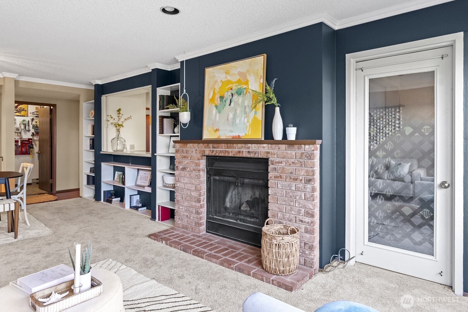1902 Bridgeport Way West, Unit 106 University Place, WA 98466 - Photo 10 of 25 a living room with furniture a fireplace and a flat screen tv