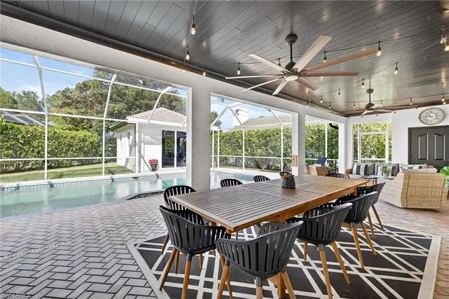 a living room with furniture fireplace and flat screen tv
