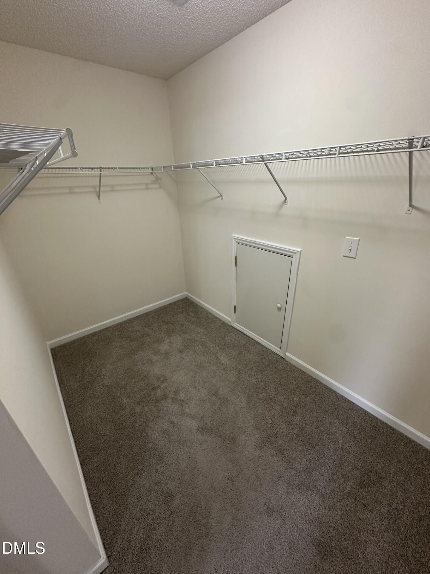 2241 Spruce Shadows Lane Raleigh, NC 27614 - Photo 12 of 18 a view of a room with racks on the wall