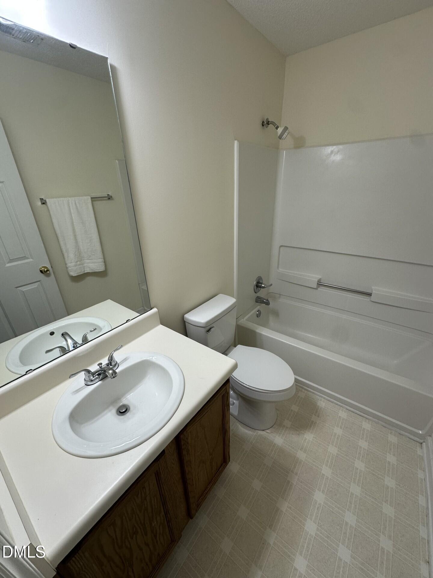 2241 Spruce Shadows Lane Raleigh, NC 27614 - Photo 16 of 18 a bathroom with a sink toilet and shower