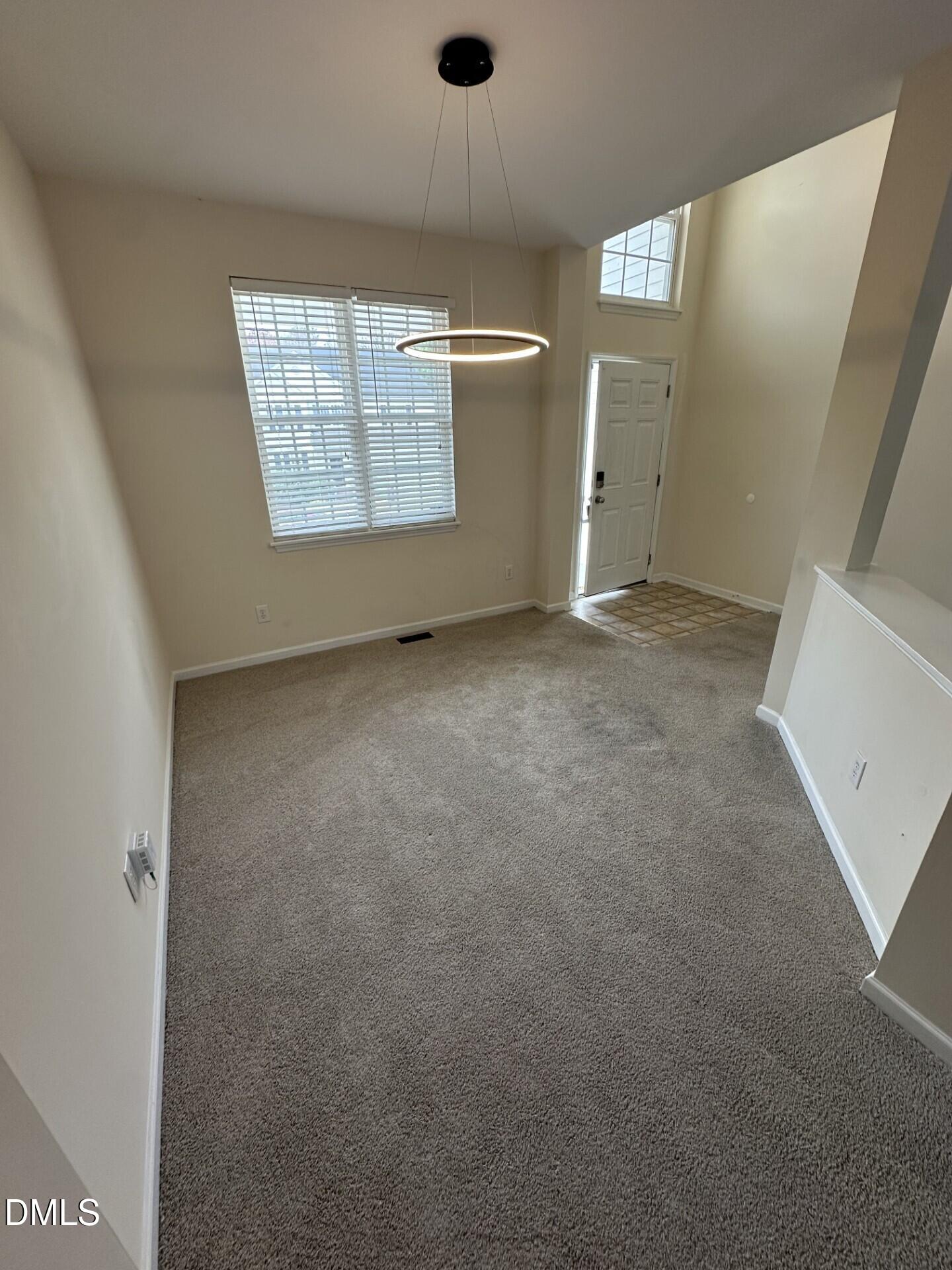 2241 Spruce Shadows Lane Raleigh, NC 27614 - Photo 4 of 18 an empty room with windows