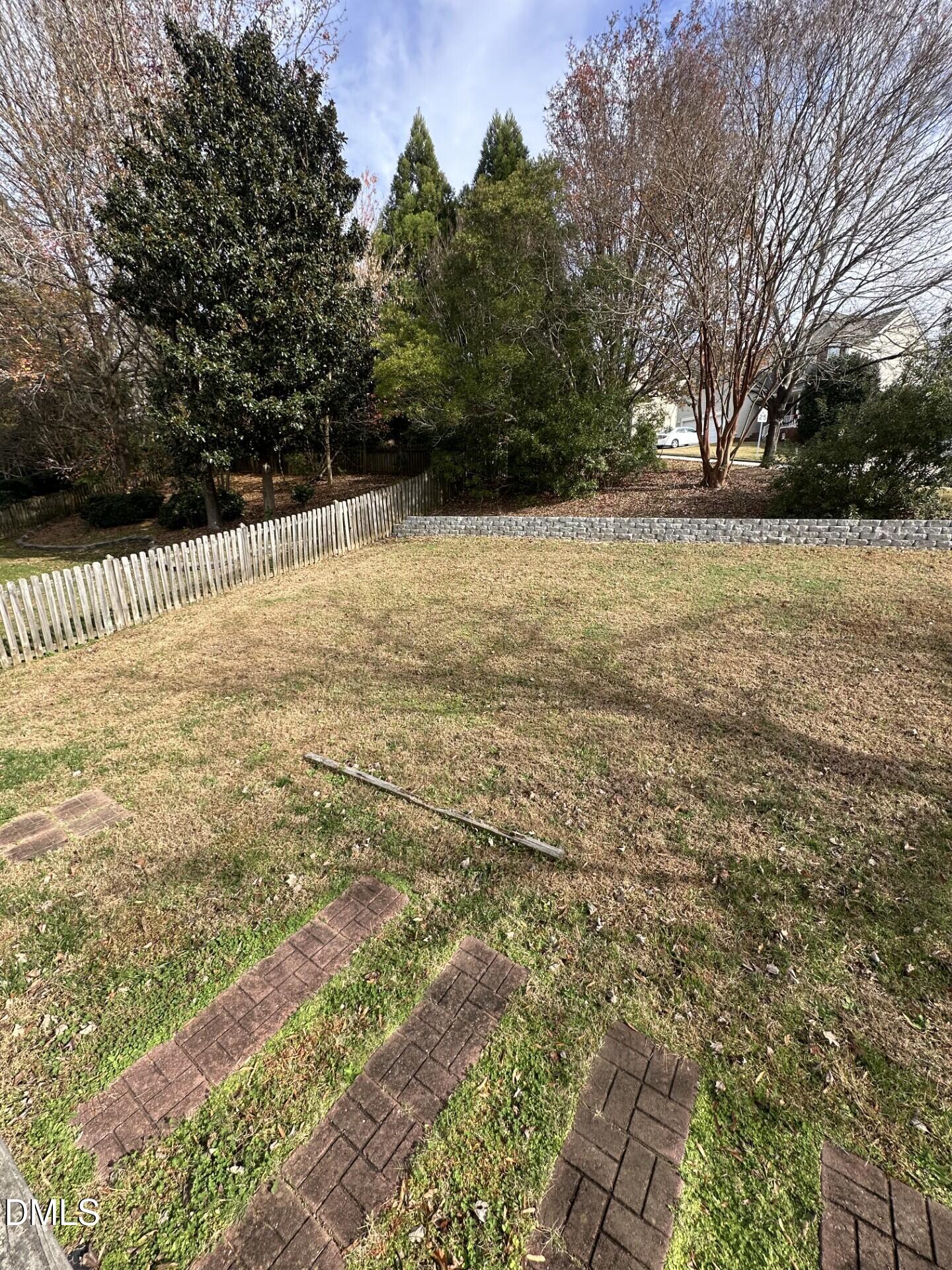 2241 Spruce Shadows Lane Raleigh, NC 27614 - Photo 8 of 18 a view of yard with wooden fence