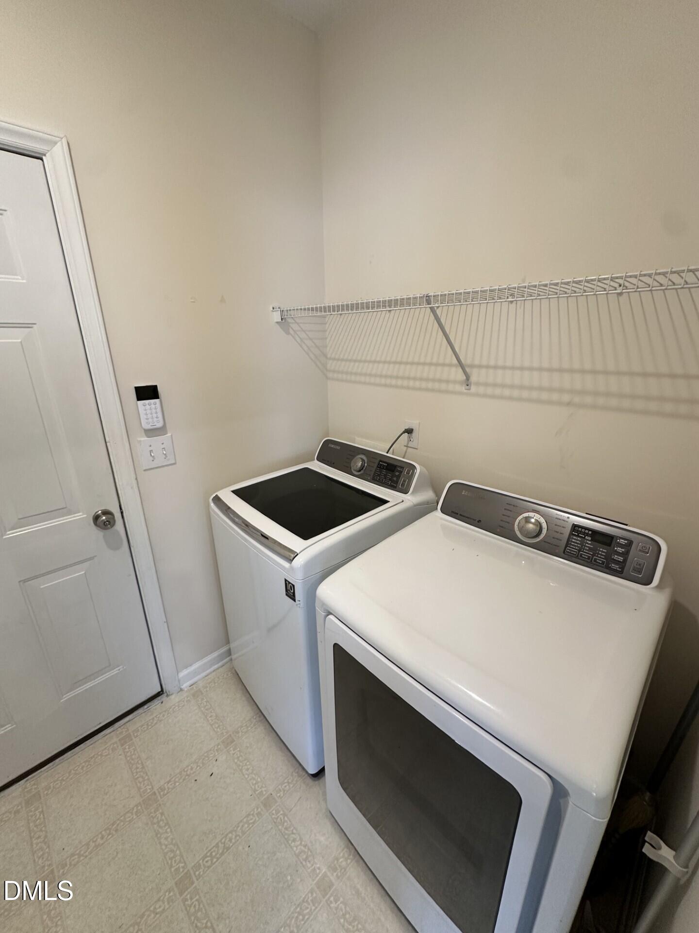 2241 Spruce Shadows Lane Raleigh, NC 27614 - Photo 9 of 18 a utility room with dryer and washer