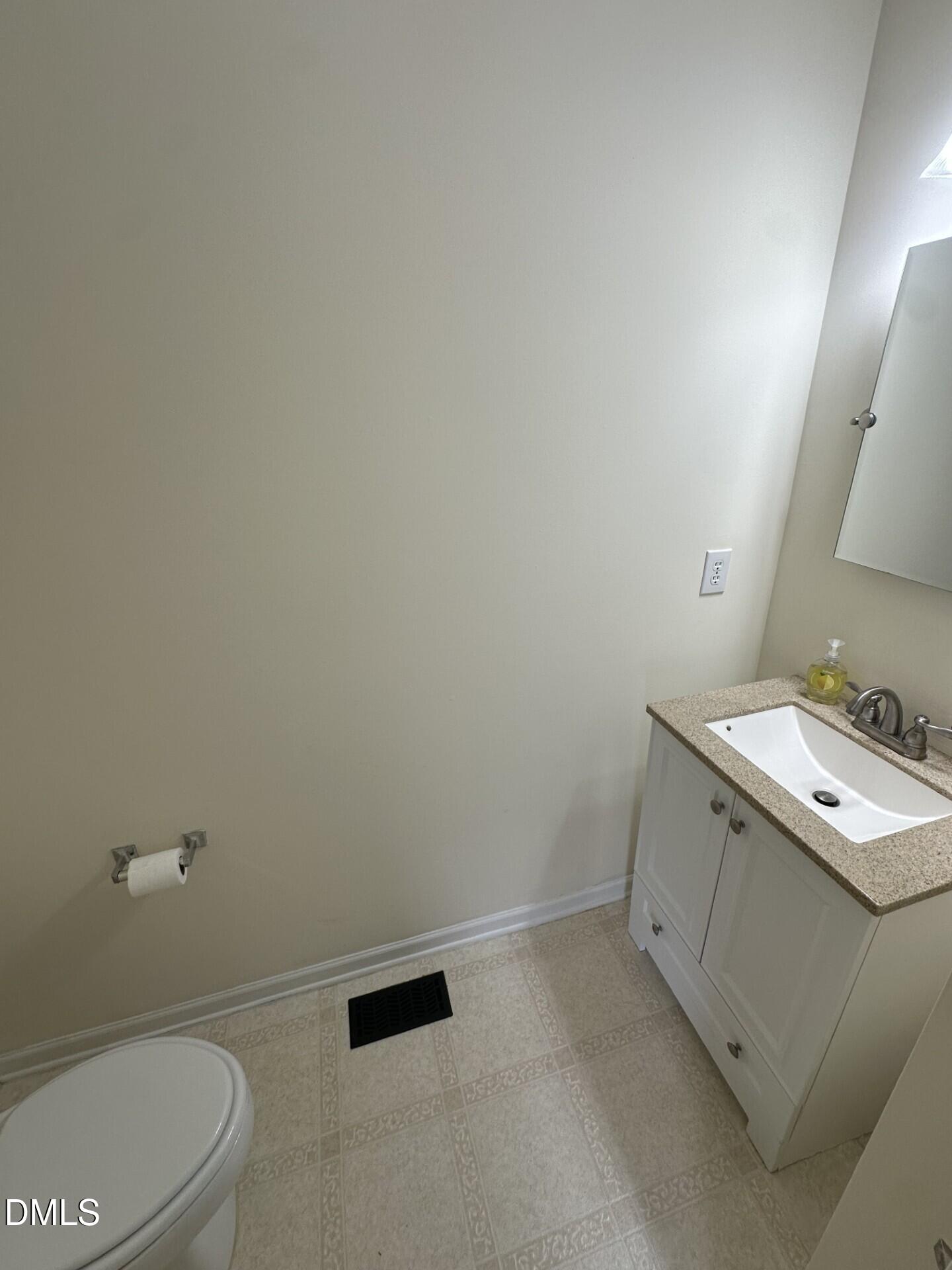 2241 Spruce Shadows Lane Raleigh, NC 27614 - Photo 10 of 18 a bathroom with a sink toilet and vanity
